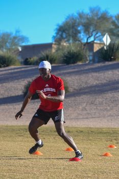 Teen athlete practicing agility drills on a sunny day in Scottsdale, Arizona.
