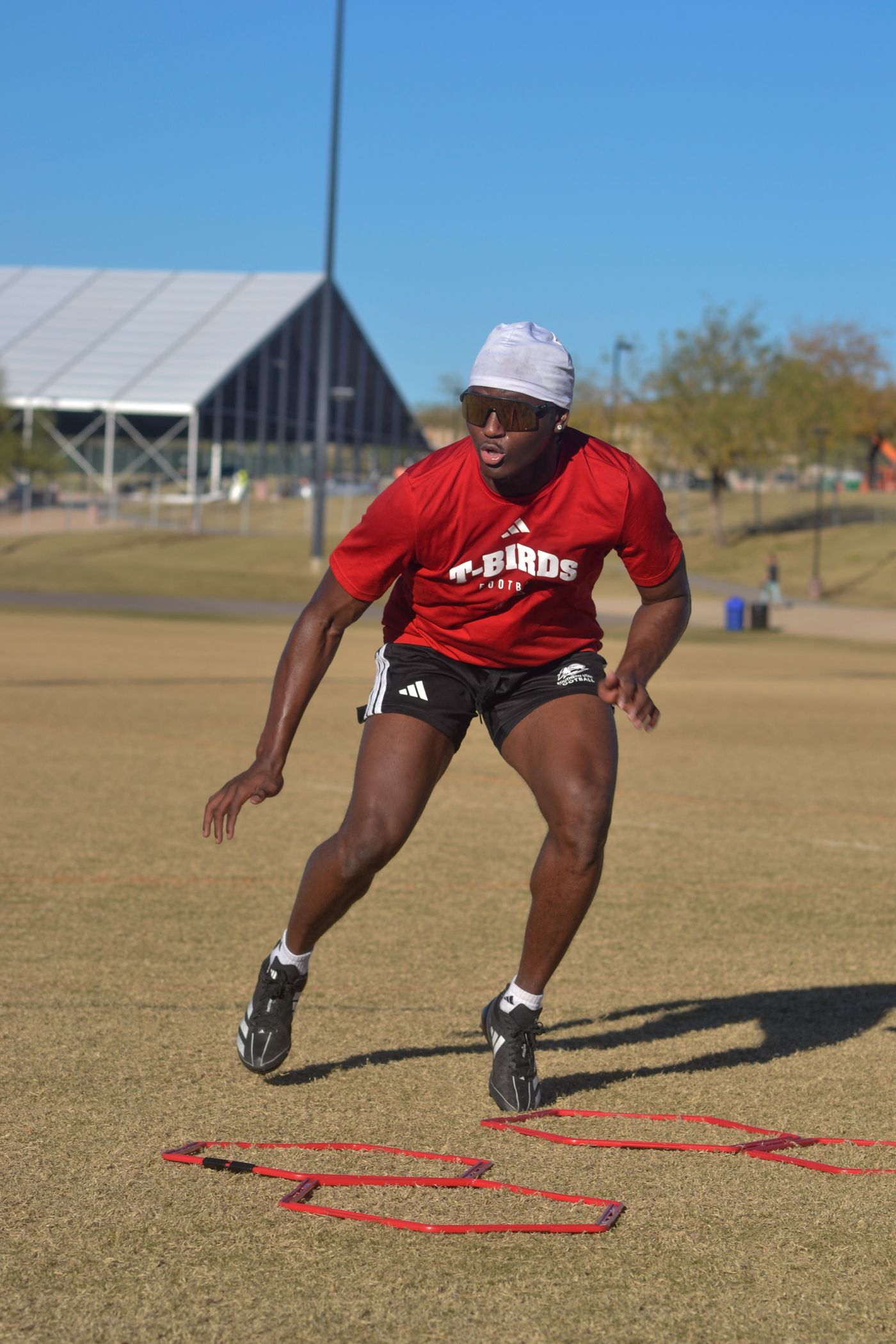 Young football athlete training outdoors during a structured practice session