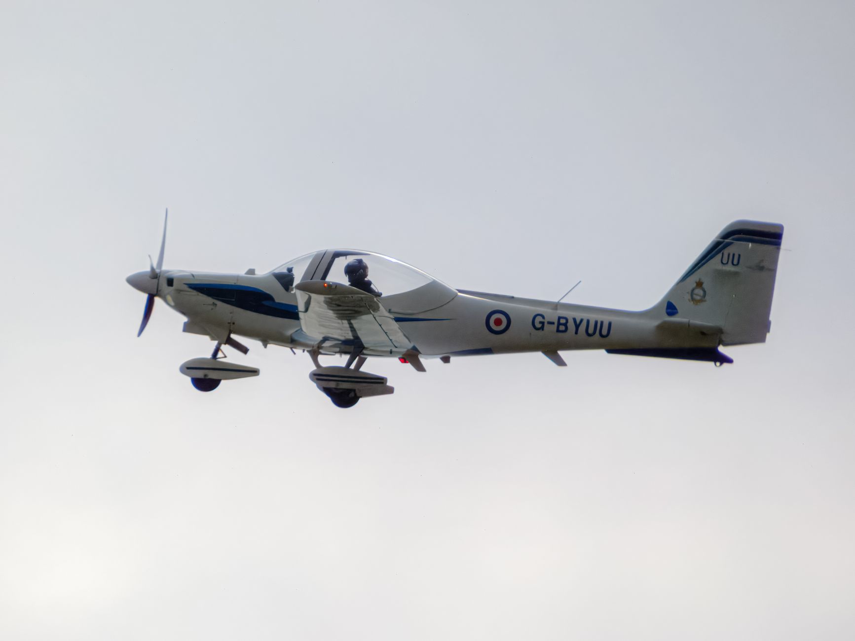 A light aircraft flying in a clear sky, showcasing aviation technology and design.