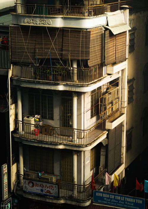 Free View of a multi-story apartment building with balconies and unique architecture. Stock Photo