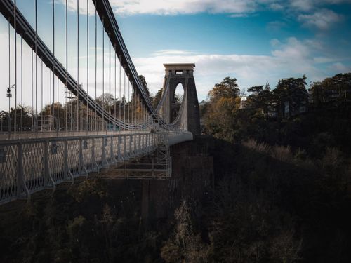 Free Iconic Clifton Suspension Bridge spanning over Avon Gorge during autumn. Stock Photo