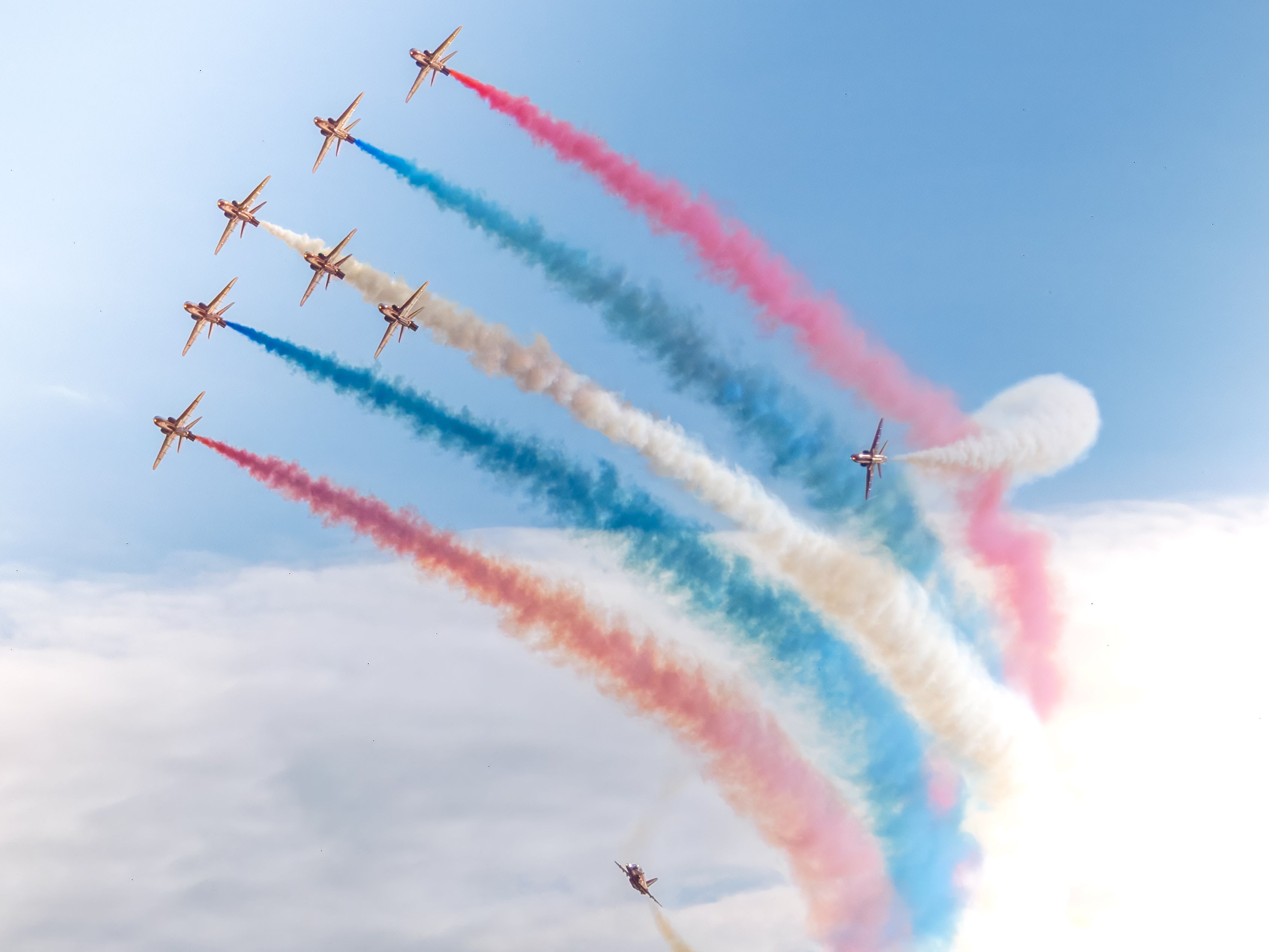 Colorful Aerobatics Display in Blue Sky · Free Stock Photo