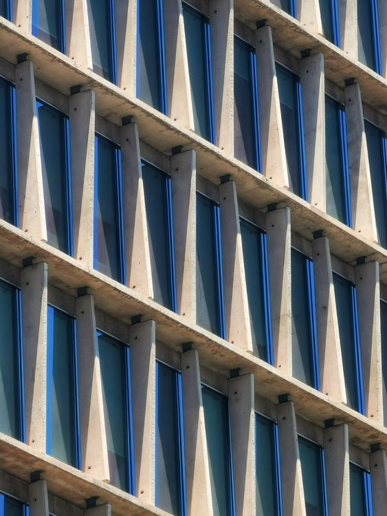 Modern Architectural Facade with Geometric Patterns · Free Stock Photo