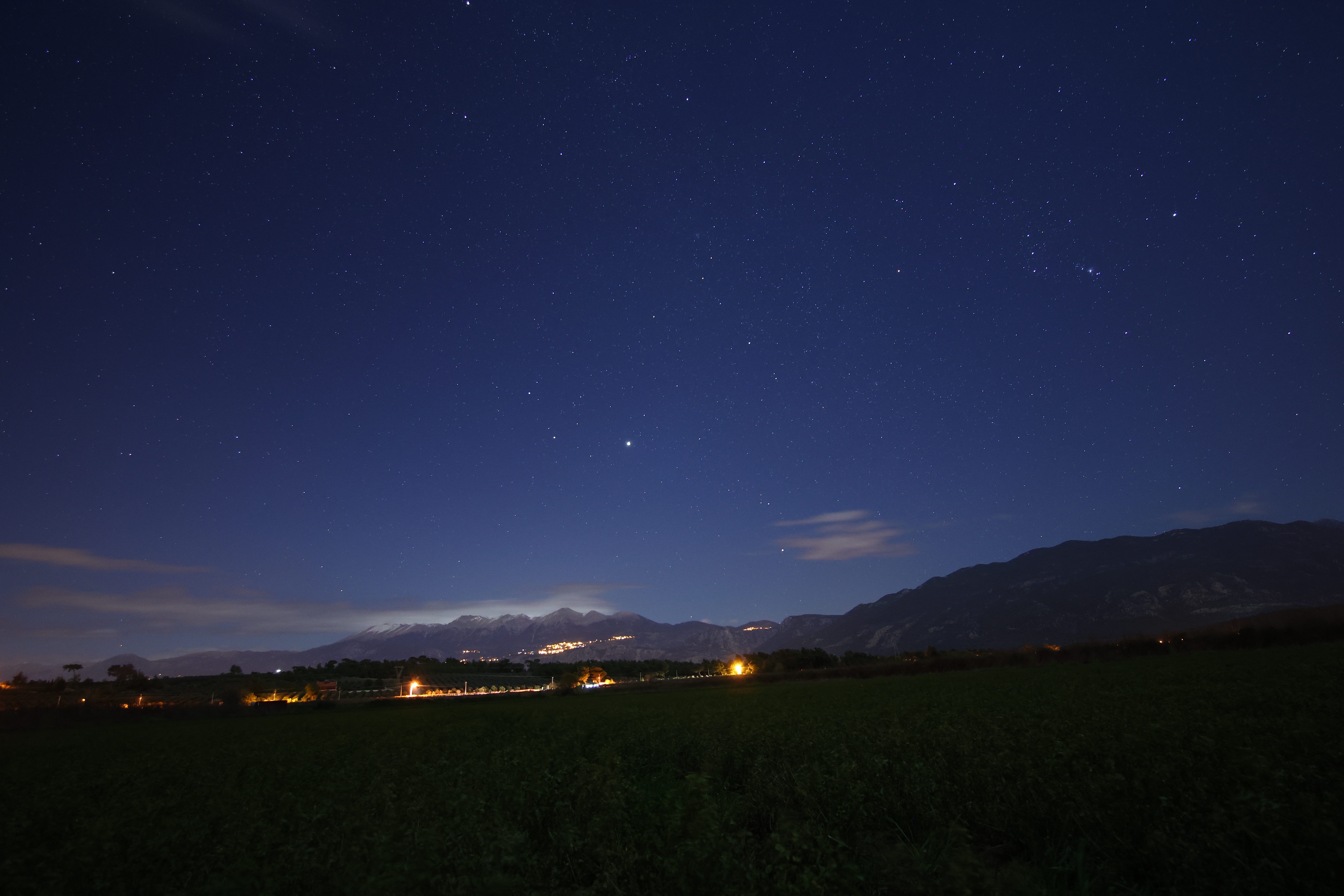 Starry Night Sky Over Mountain Landscape · Free Stock Photo