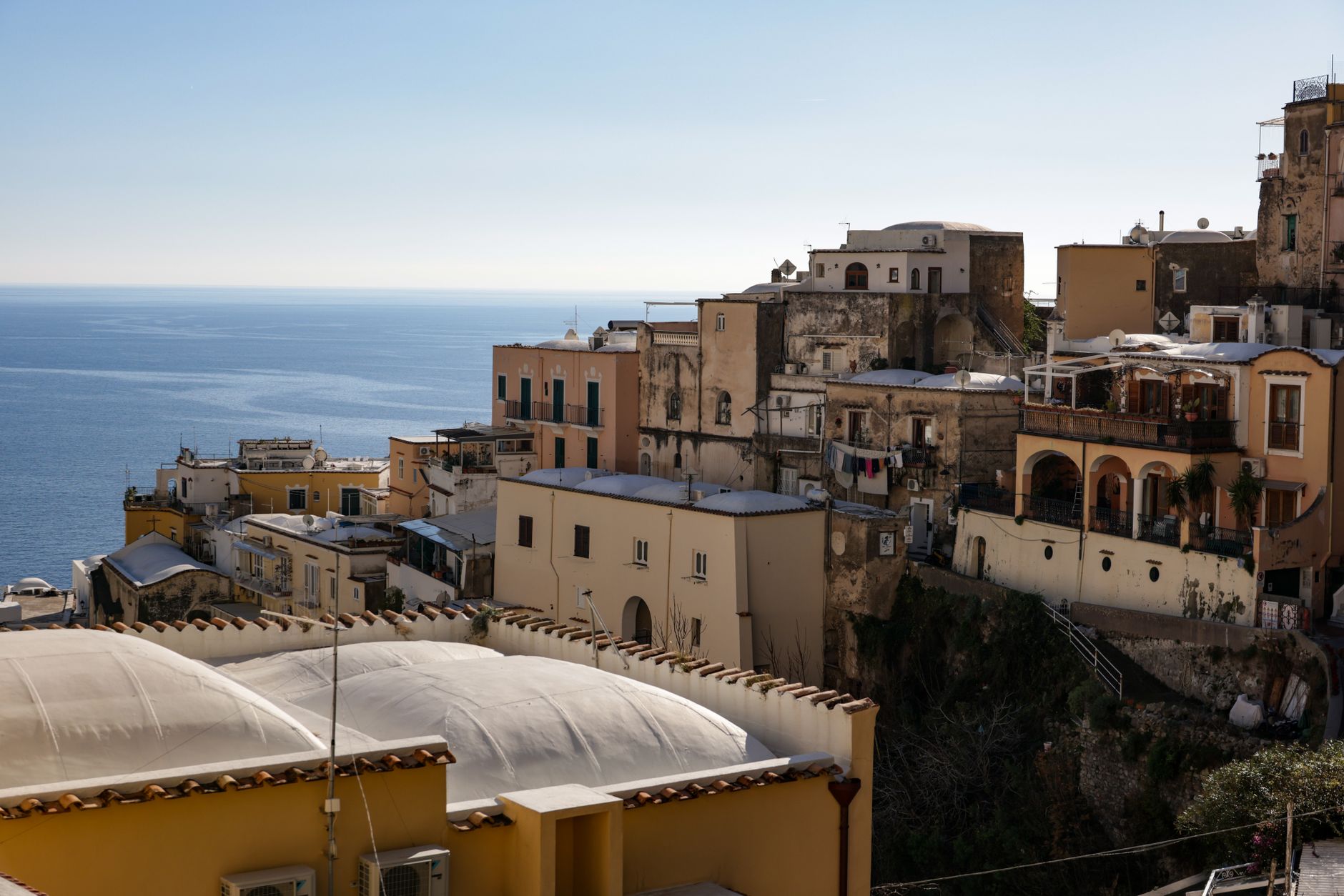 Charming hillside homes on the Amalfi Coast with stunning sea views, showcasing Italian architecture.