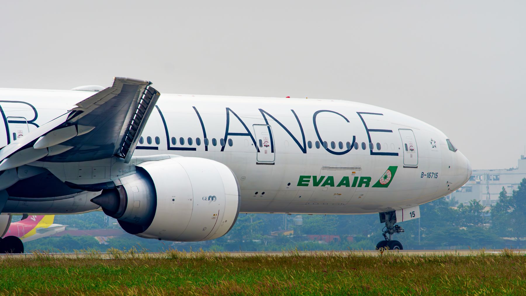 Close-up of EVA Air airplane on runway, Ho Chi Minh City airport.