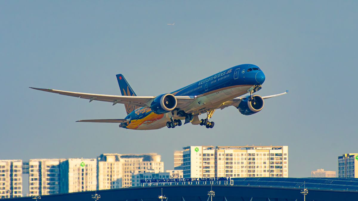 Vietnam Airlines plane taking off in Ho Chi Minh City. Vietnam Airlines plane taking off in Ho Chi Minh City.