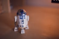 Close-up of R2-D2 toy on a wooden surface