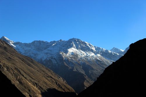 Free Breathtaking view of snow-capped mountains under a clear blue sky. Stock Photo