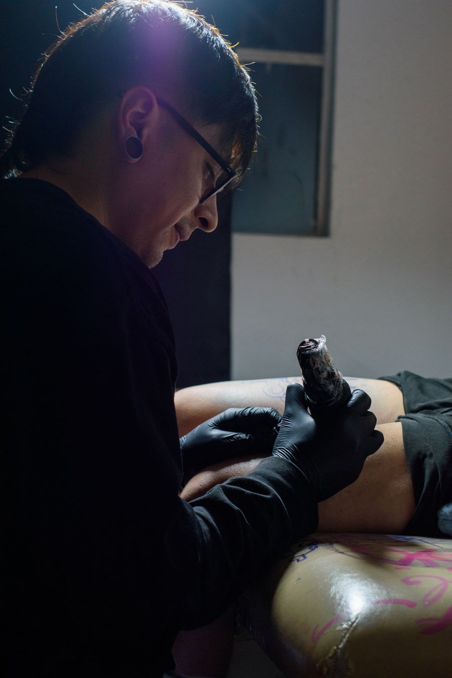 Temporary stock portrait representing a Tattoo Phil's artist at work