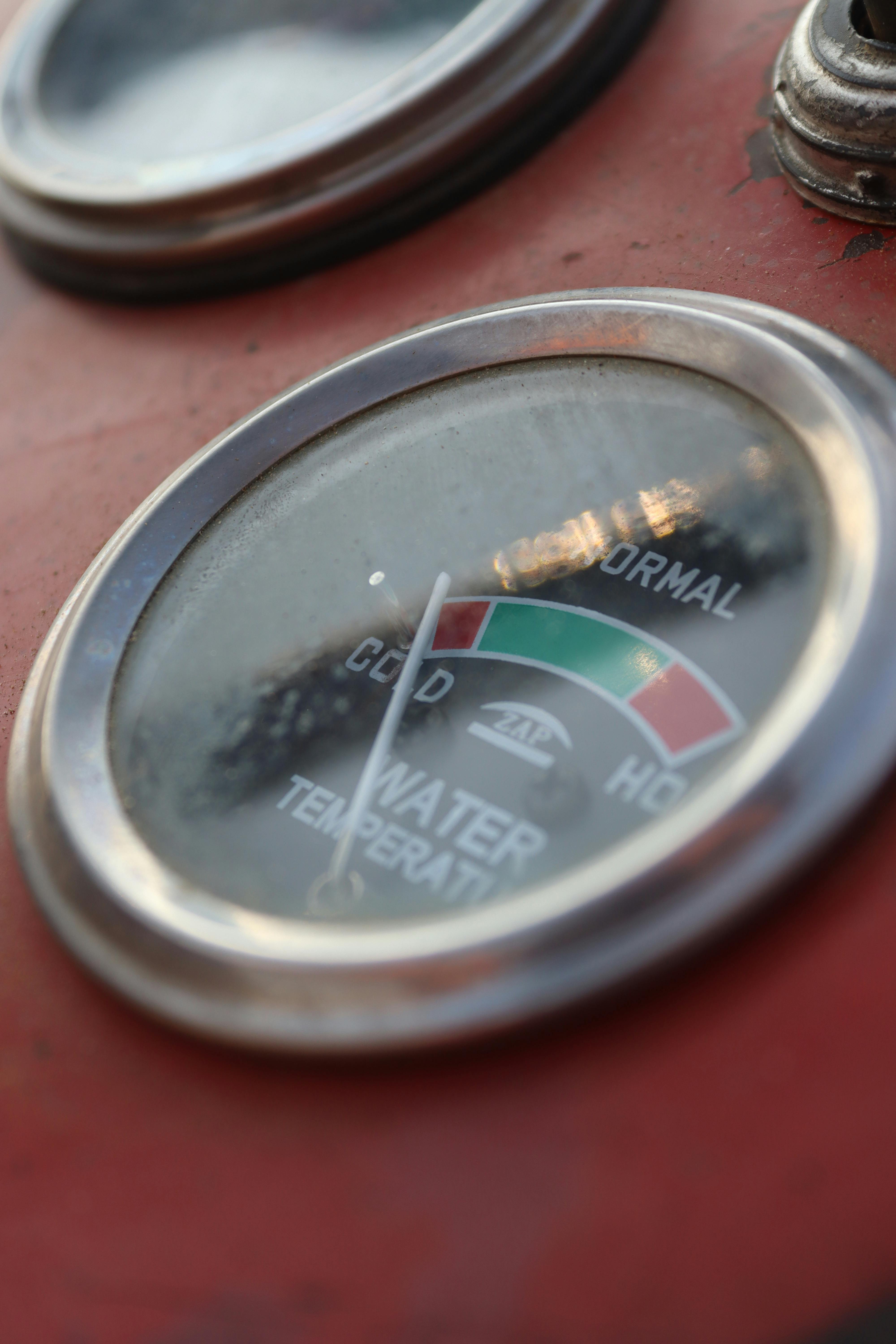 Detailed image of a vintage water temperature gauge showing cold, normal, and hot ranges.