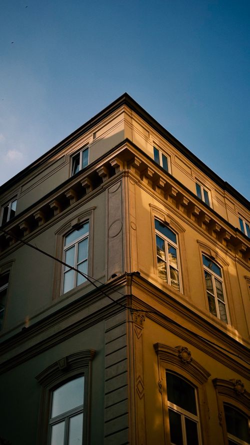 Free Elegant historic building corner in Istanbul with warm sunlight and clear blue sky. Stock Photo