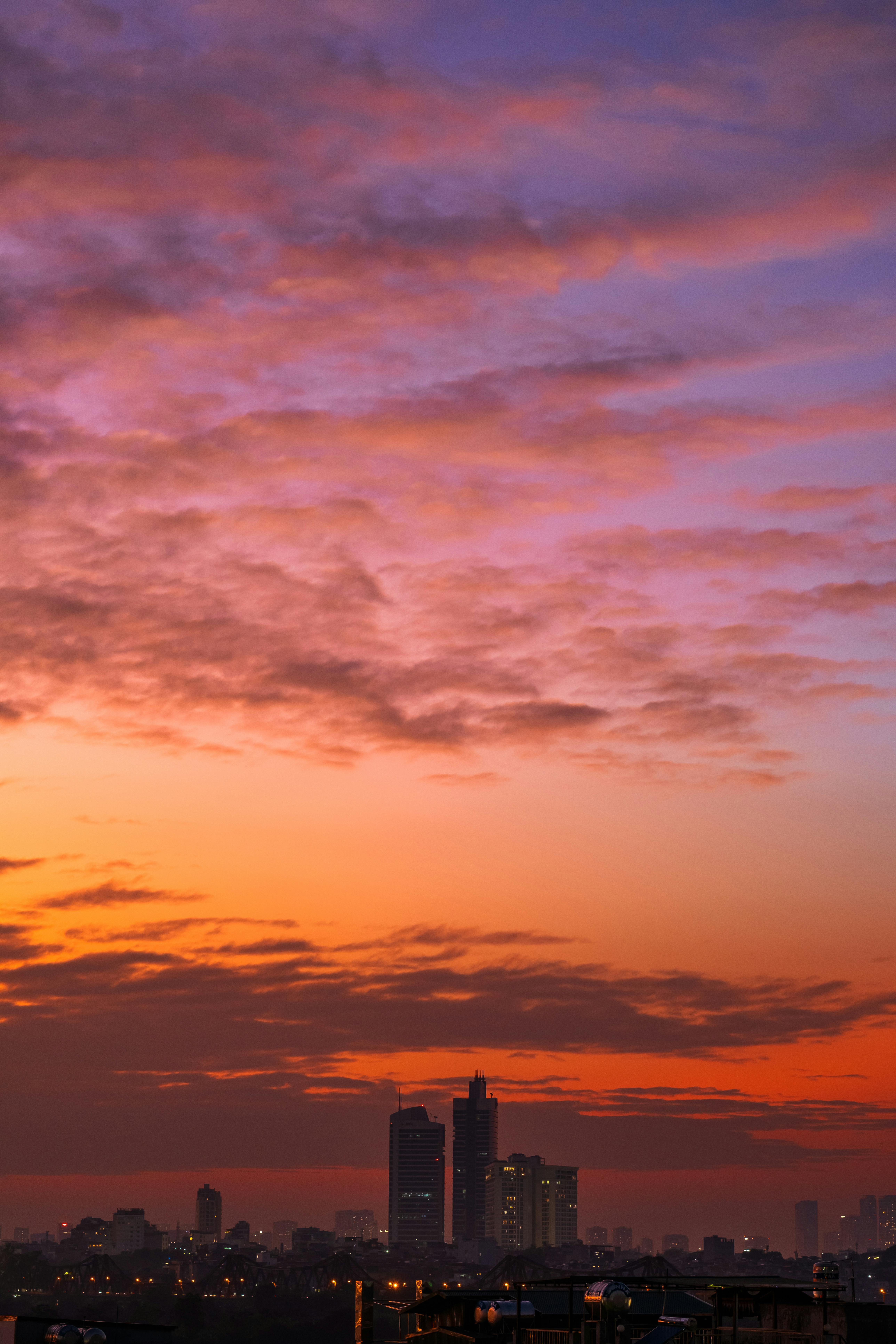 Sunrise over city skyline representing fresh daily content rhythm