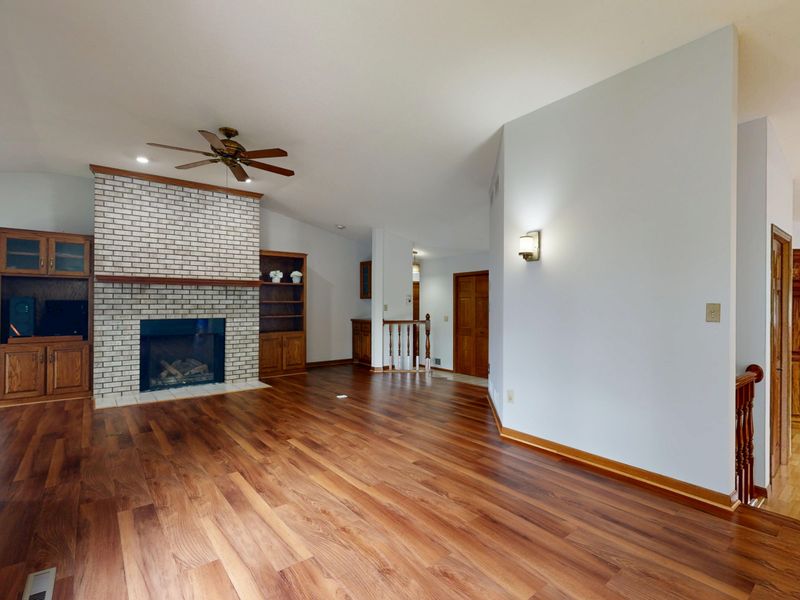 Family room with hardwood floor and fireplace