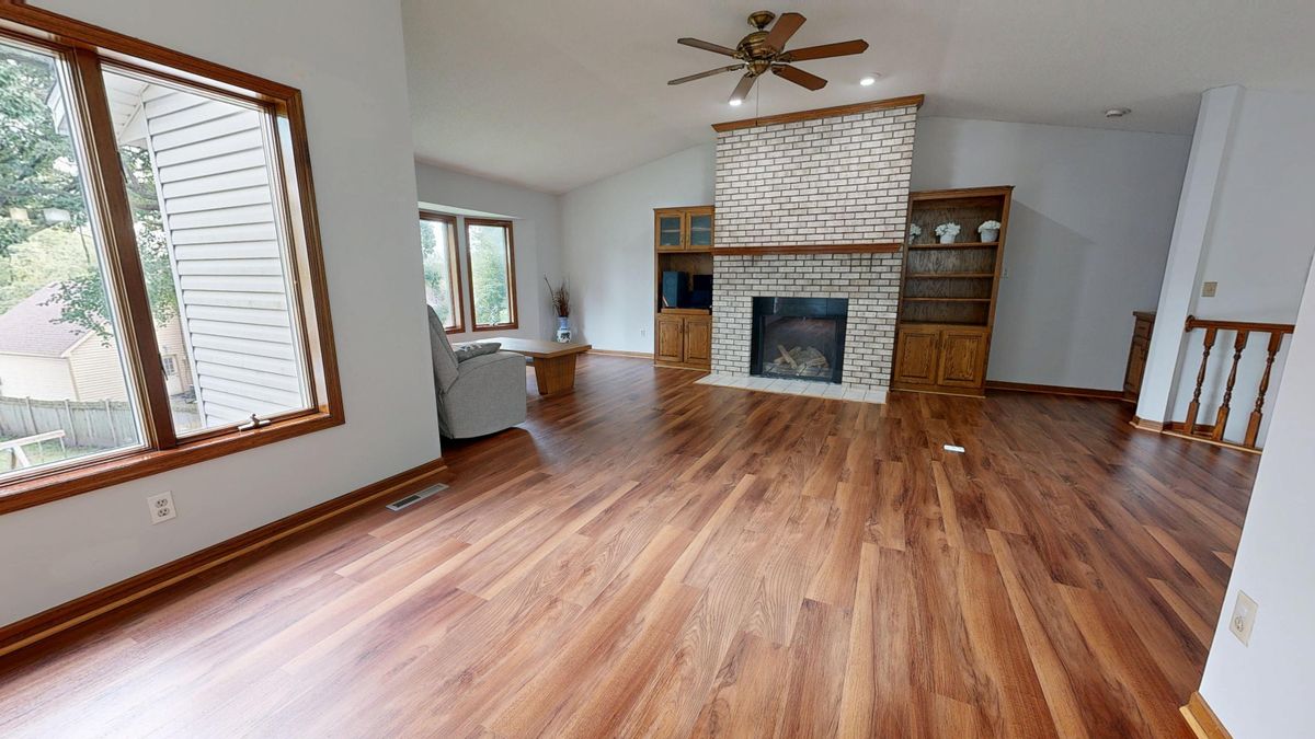 Same room after flooring installation — stunning new hardwood