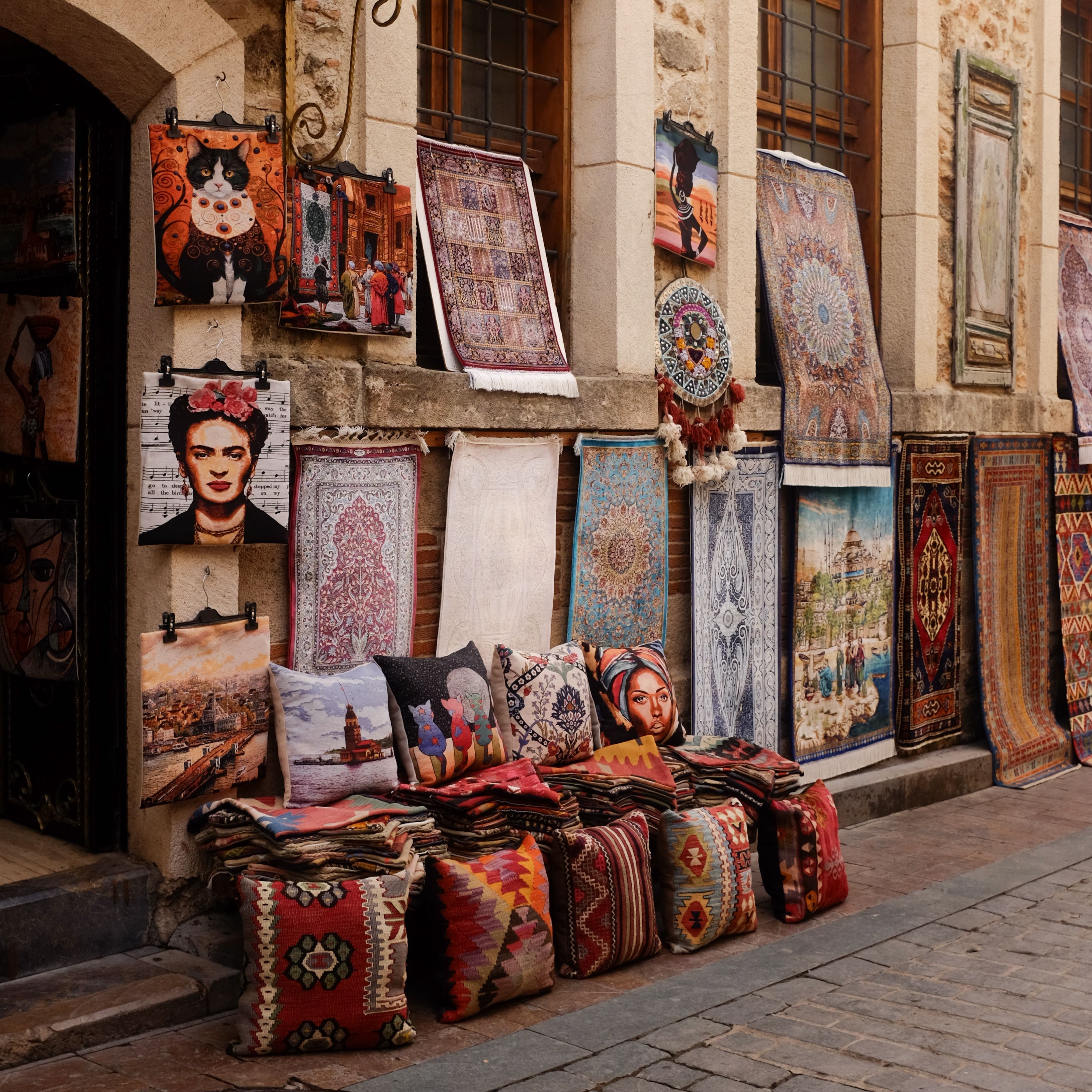 Colorful Bazaar with Ethnic Rugs and Pillows Display · Free Stock Photo