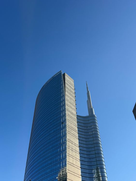 Milan High Rise Building Modern Skyscraper Against Blue Sky in Milan · Free Stock Photo