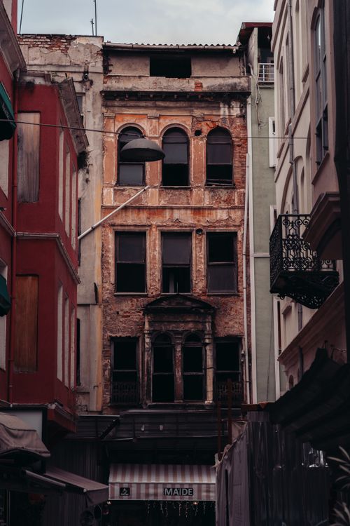 Free Explore the rustic charm of an aged building in a quaint Istanbul street, capturing urban decay and historical allure. Stock Photo