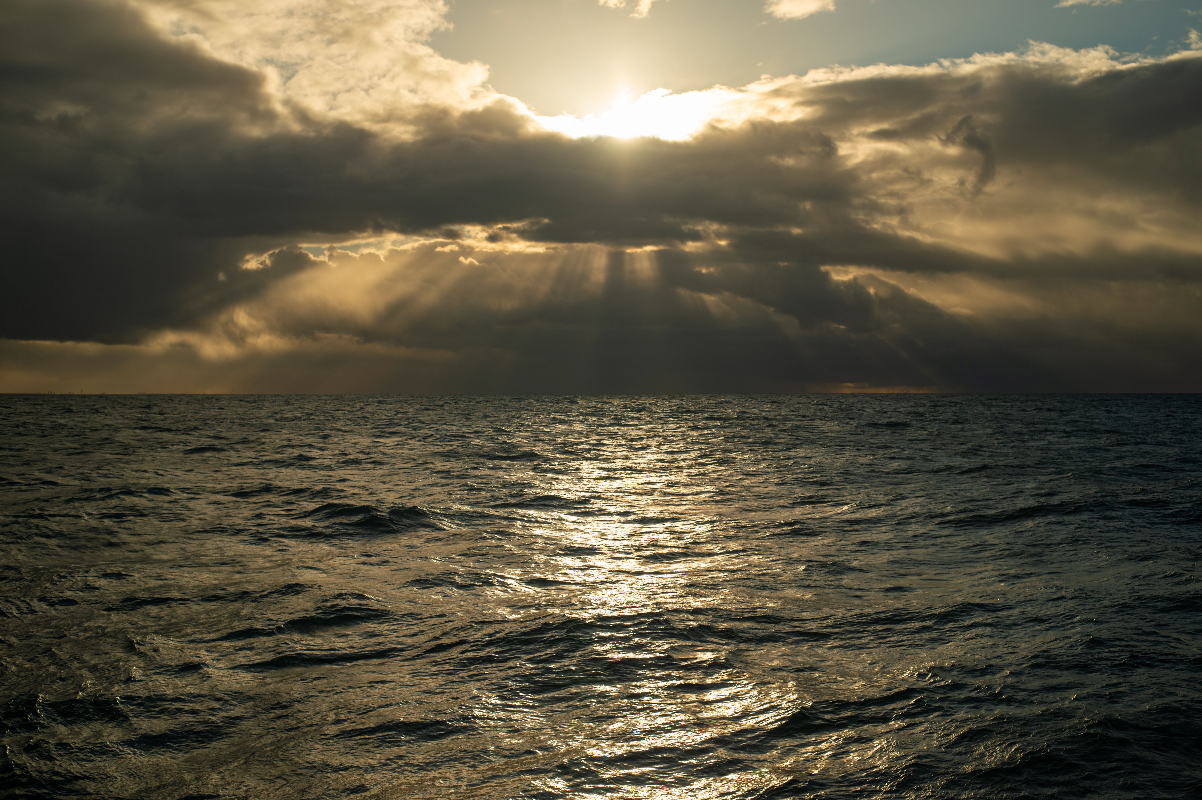 Dramatic Ocean Sunset with Sun Rays · Free Stock Photo