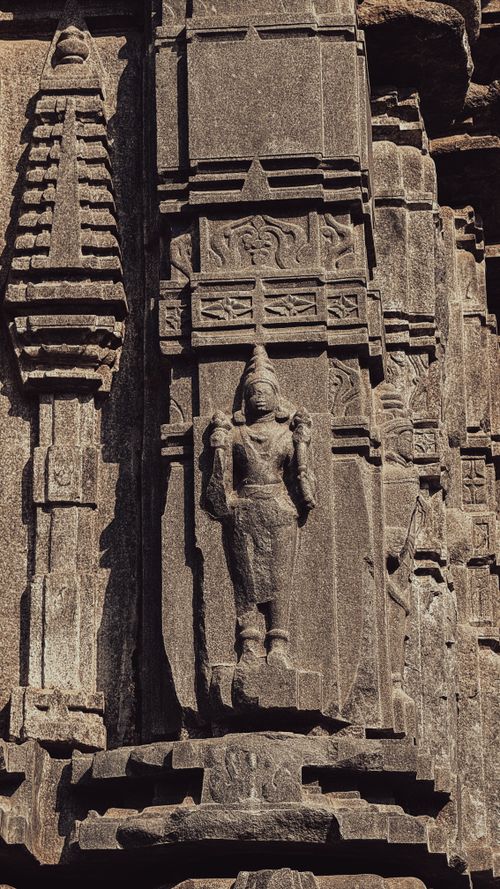 Free Intricate stone carvings on ancient temple facade in Warangal, India depicting traditional Indian architecture. Stock Photo