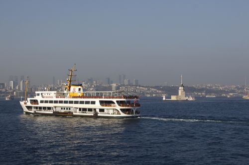 Free Ferry on Bosphorus with Istanbul skyline and Maiden's Tower in the background. Stock Photo