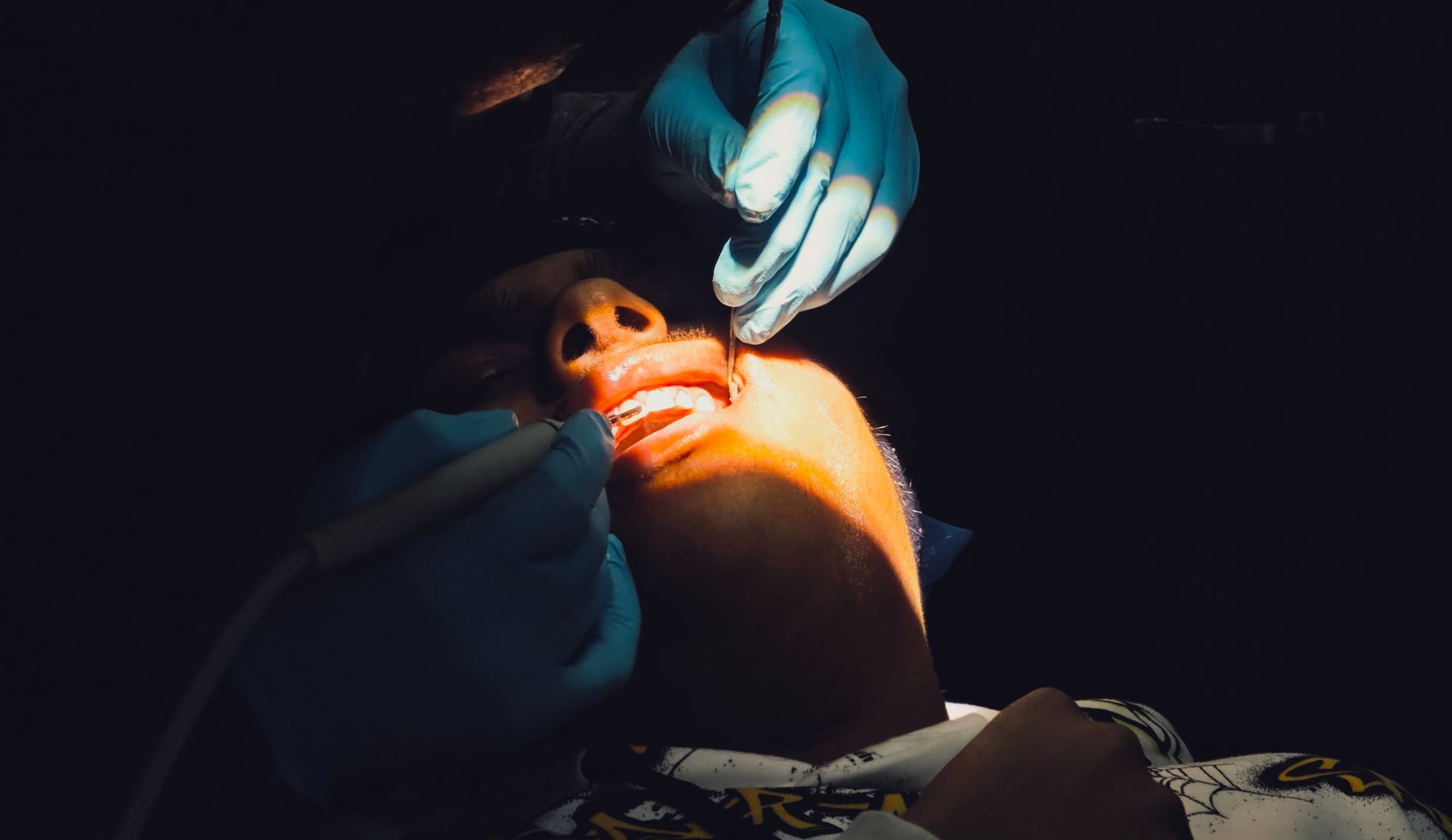 A dentist smiling gently with a patient at Ohud Dental, Lahore