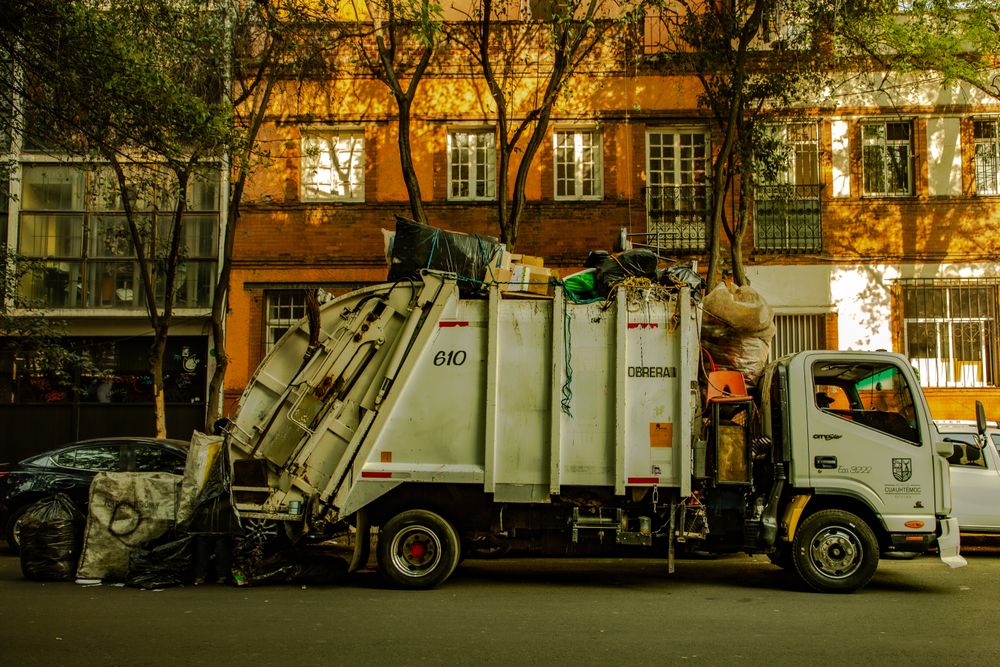 Junk removal and hauling truck parked on a residential street, the type of business that runs Google Ads for junk removal to fill its daily schedule