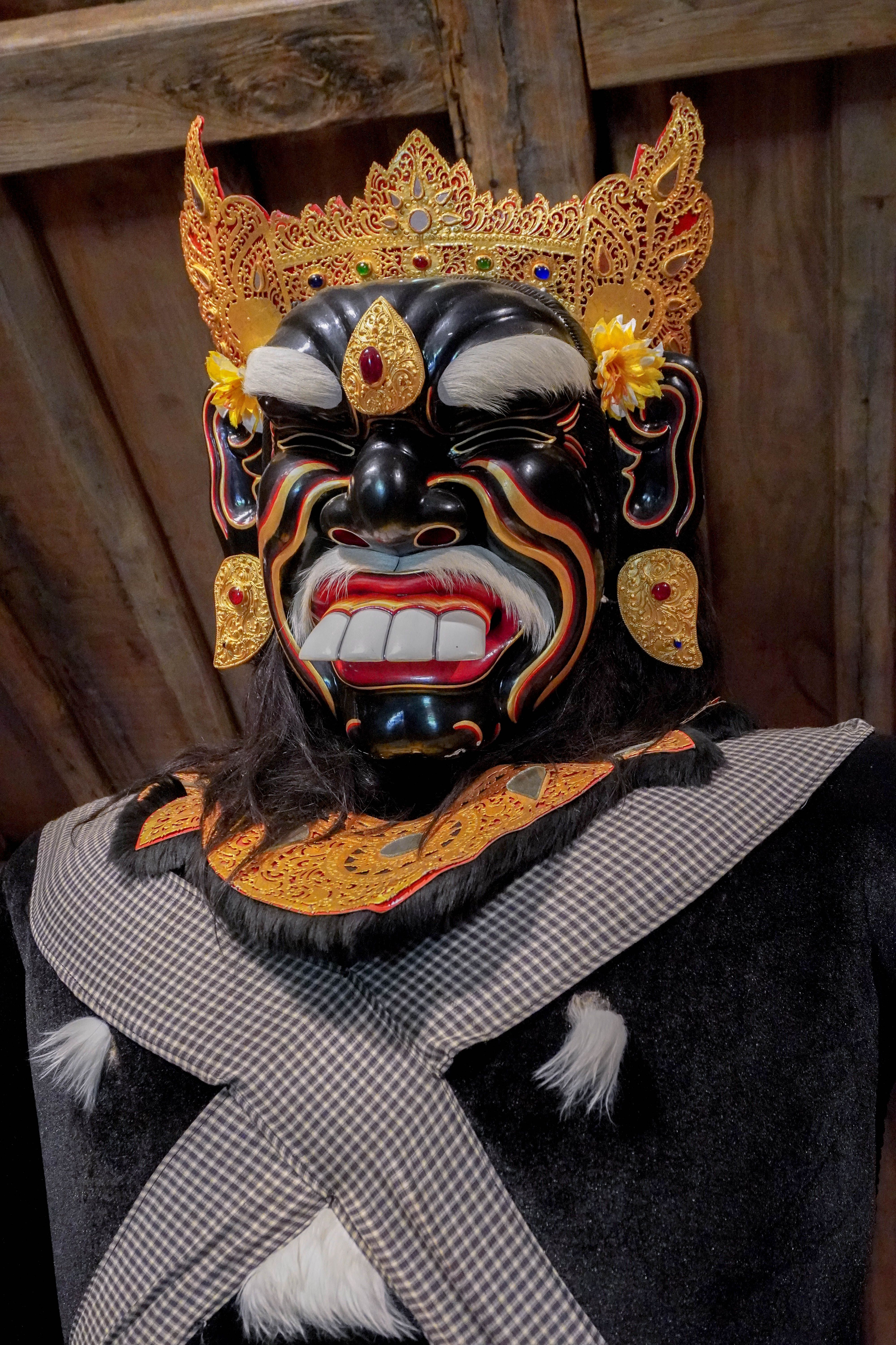 A detailed close-up of a Balinese Barong mask showcasing traditional artistry and vibrant design.