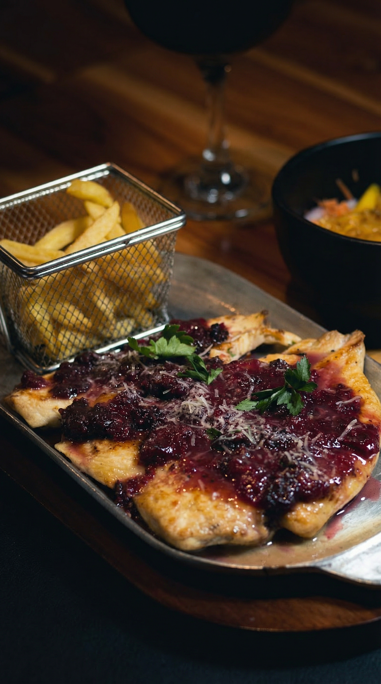 Delicious Colombian-style chicken with berry sauce, served with fries. Perfect for dinner.