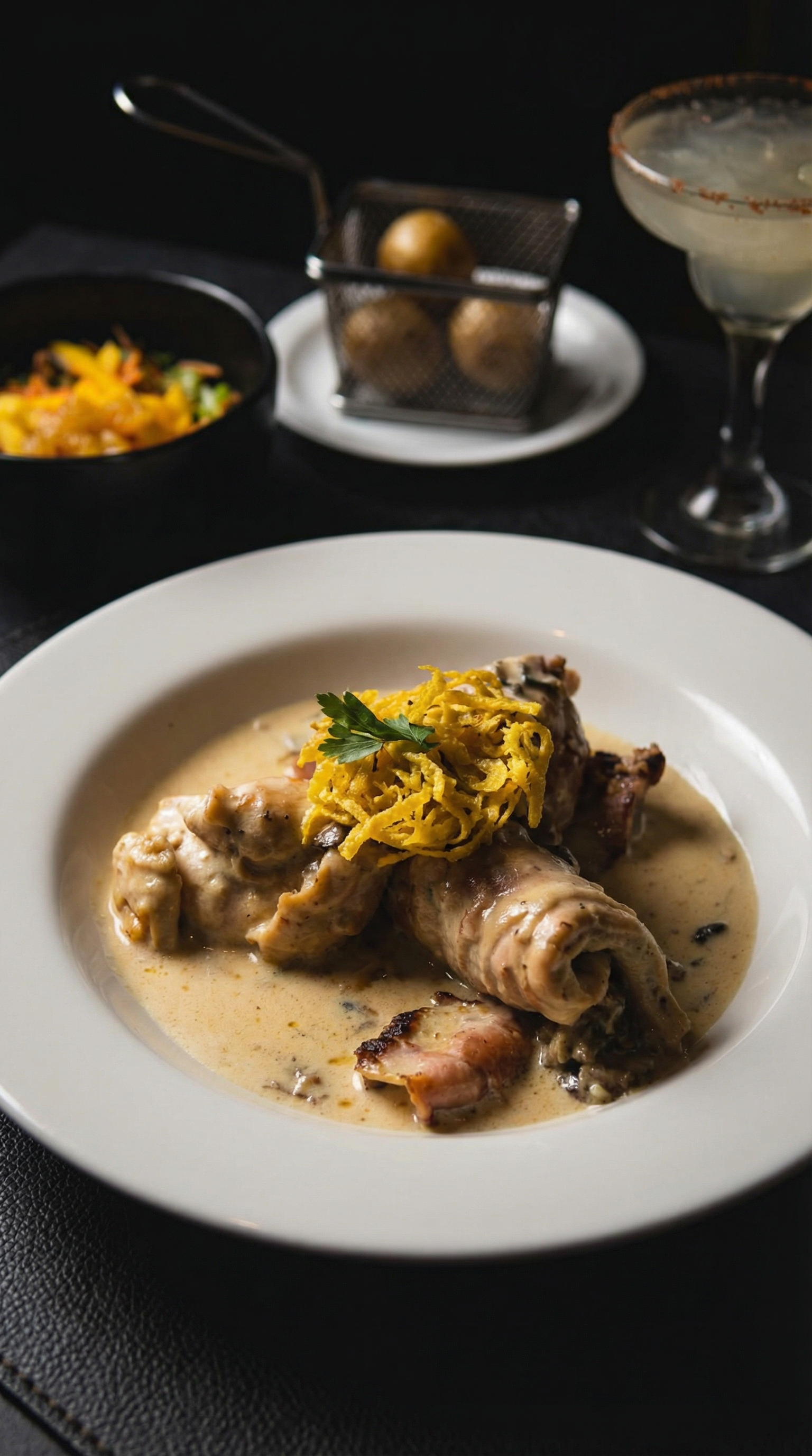 Elegant Colombian dish with creamy sauce and garnish, perfect for gourmet dining.
