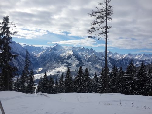 Free Snow-covered Alps with a clear blue sky, ideal for winter travel inspiration. Stock Photo
