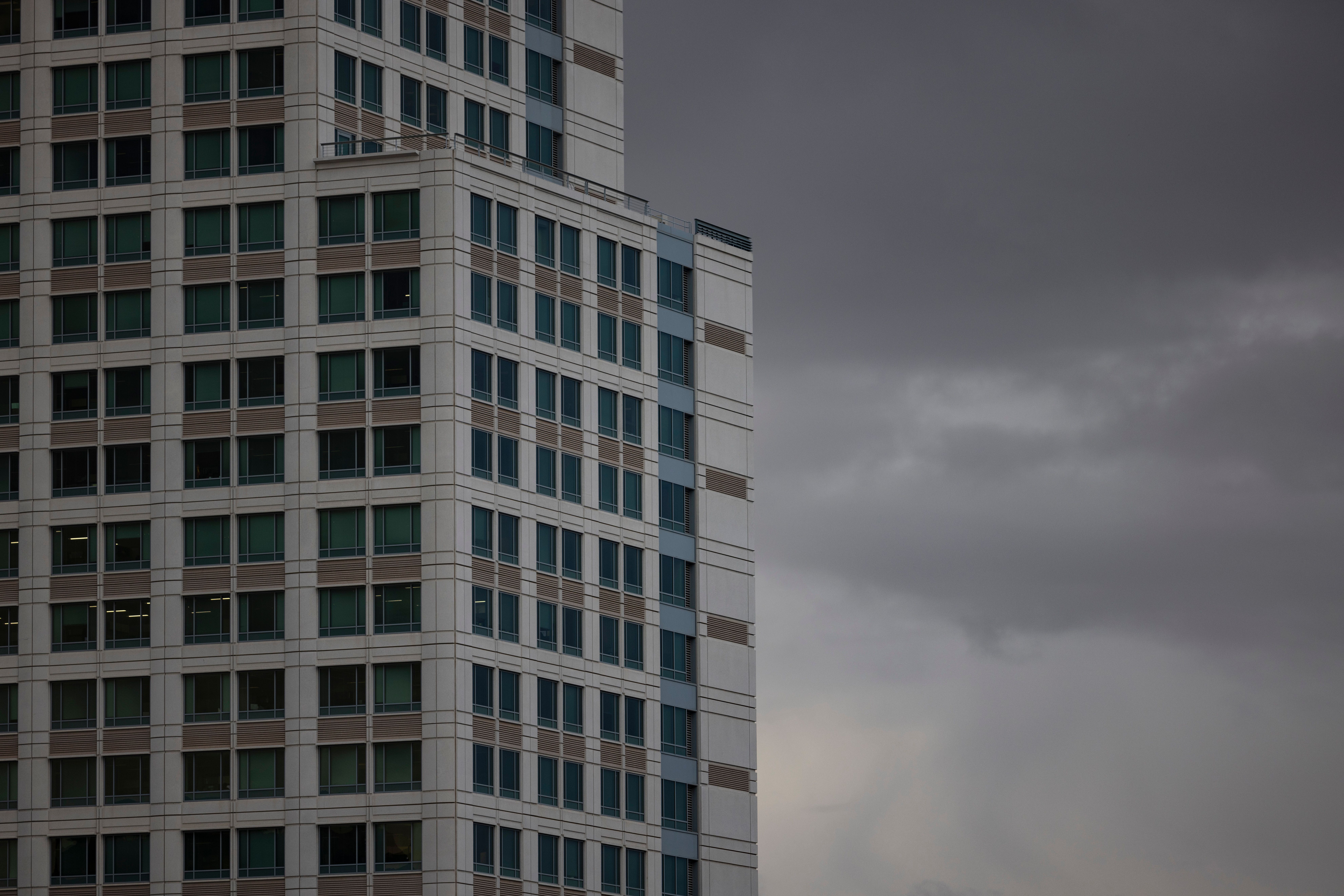 Modern Office Building Against Cloudy Sky · Free Stock Photo