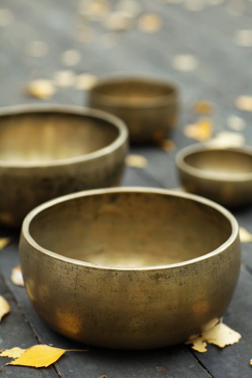 Close-up Photography of Bronze Bowls