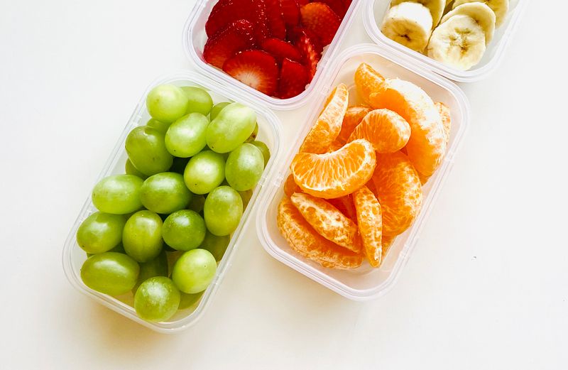 fridge drawer filled with small snack containers