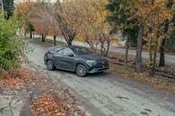 Luxury Car On Scenic Autumn Road