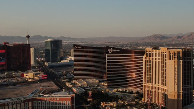 A stunning aerial view of the Las Vegas Strip showcasing iconic hotels and cityscape at sunset.