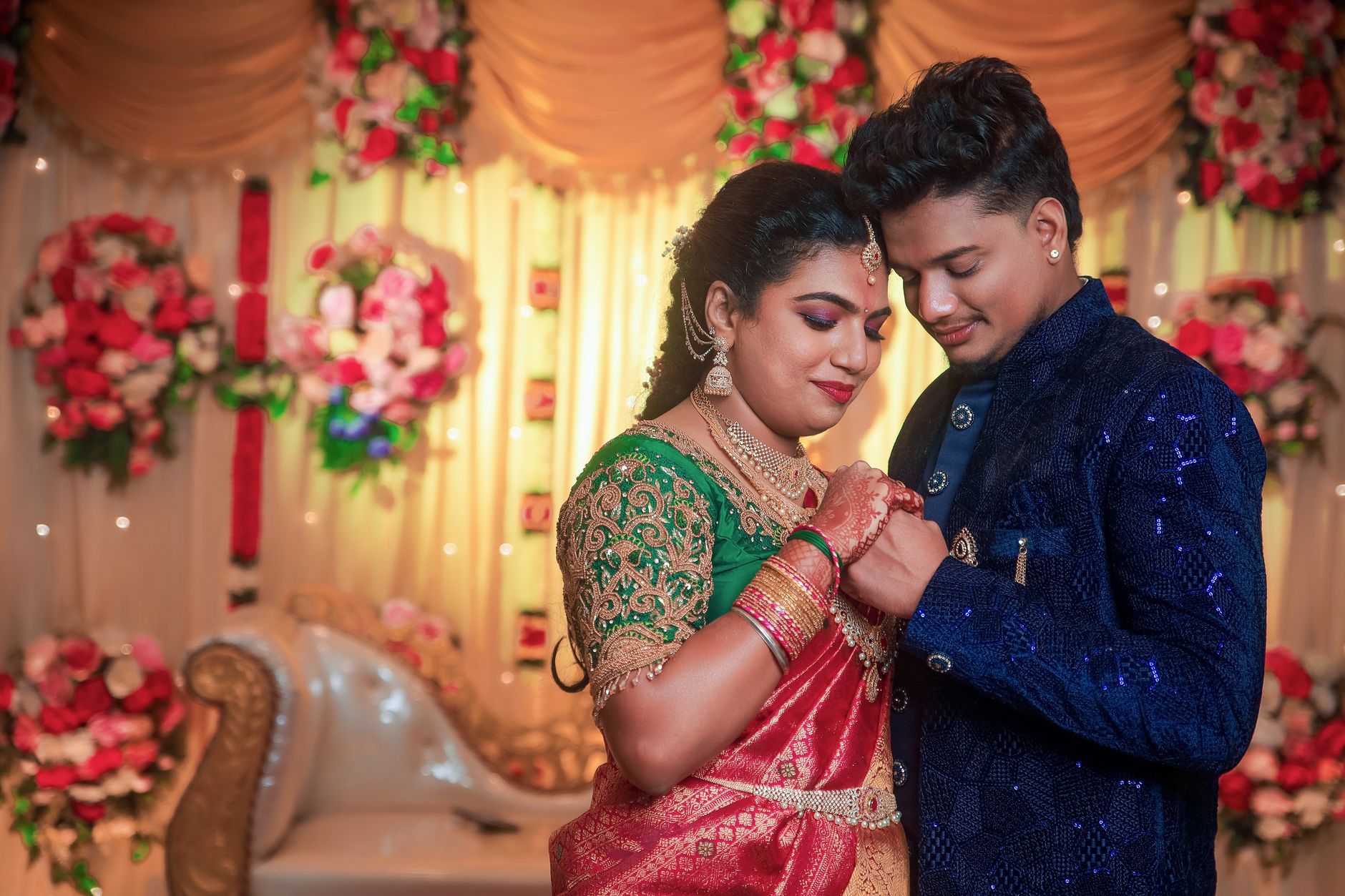 A joyful Indian couple in traditional attire during their wedding ceremony in Chennai.