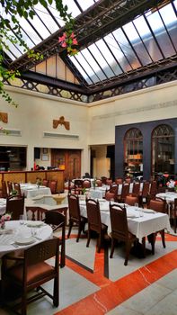 A well-lit Syrian restaurant with elegant traditional decor in Damascus, Syria.