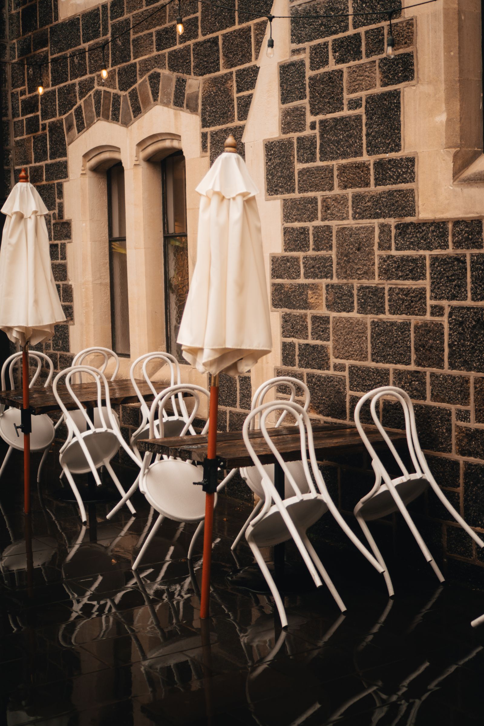 Quiet outdoor cafe atmosphere on a rainy day