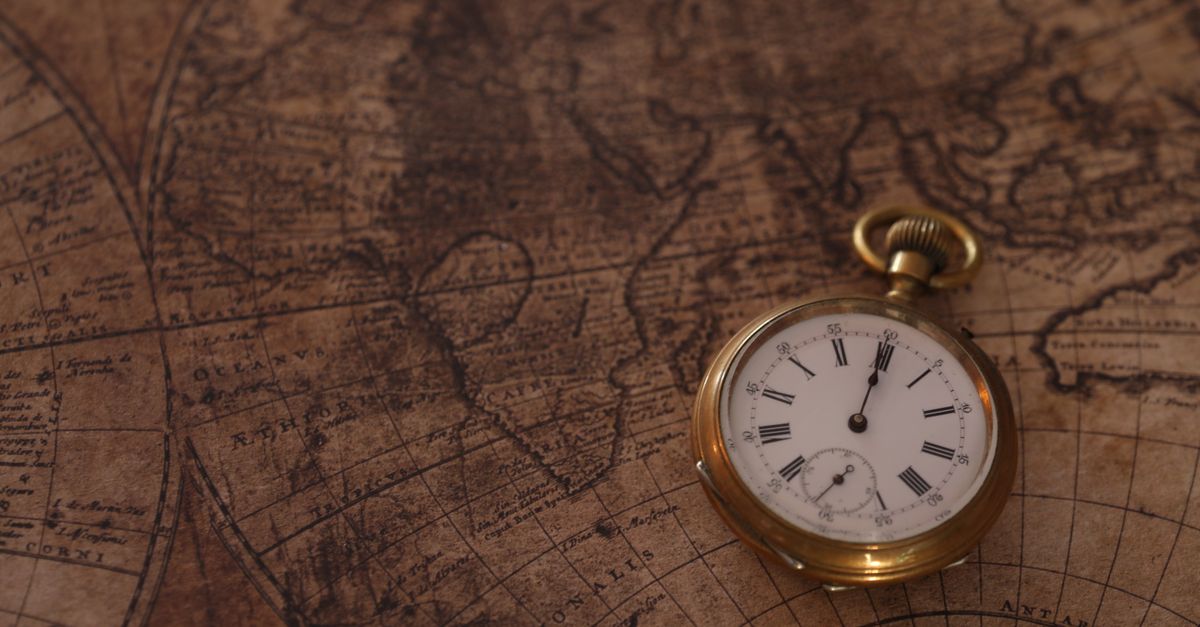 world map with highlighted time zones and clock icons