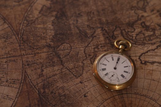 A classic pocket watch rests on an old world map, evoking a sense of history and time travel.. pexels, classic, pocket