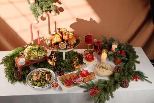 Capture the essence of holiday celebrations with a festive table adorned with roast chicken and seasonal decor.