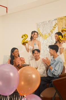 A joyful 25th birthday party scene with friends celebrating indoors with balloons and cake.