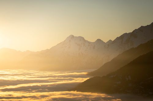 Free Breathtaking golden sunset over the mountains of Crans-Montana, Switzerland. Stock Photo