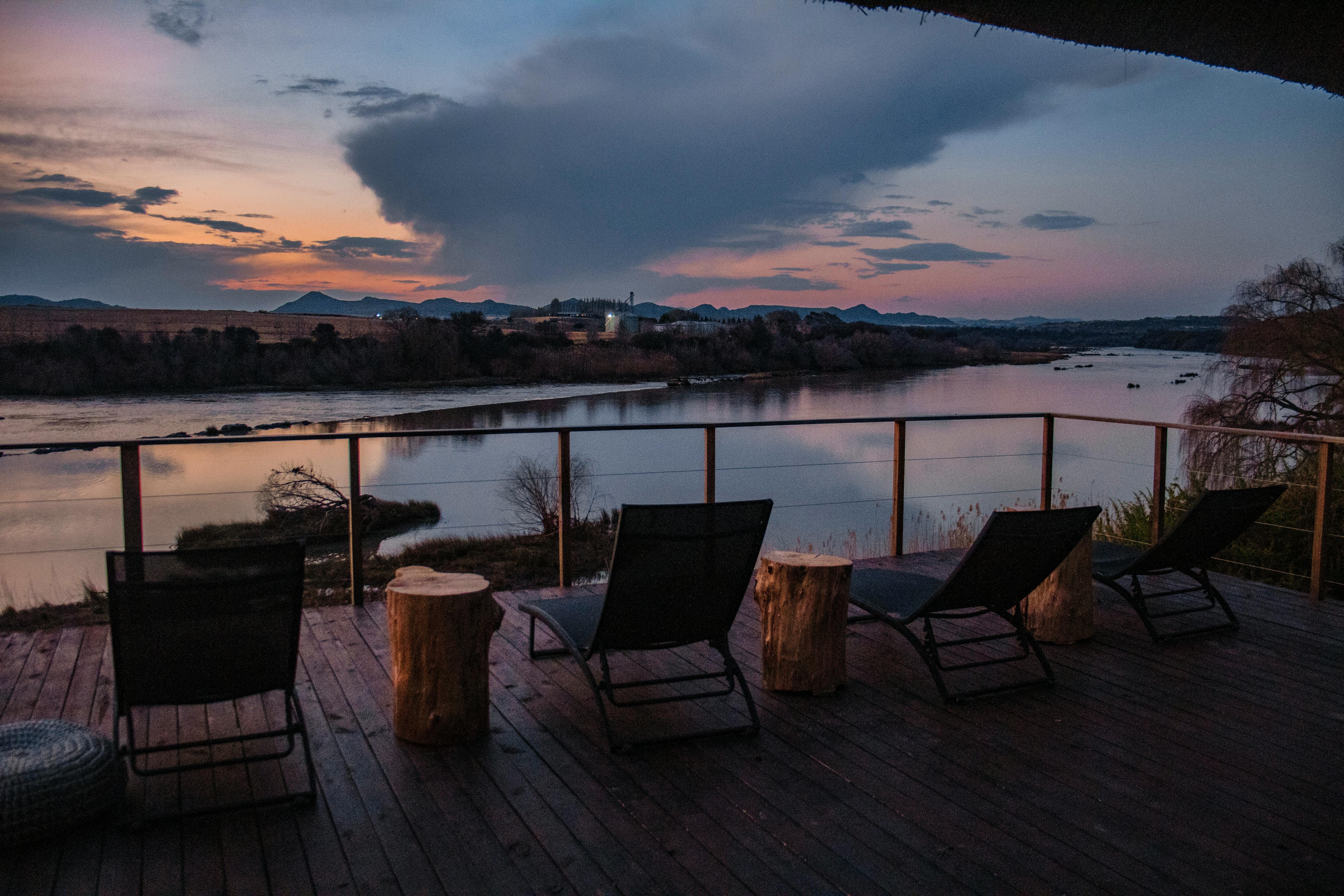 A well‑maintained backyard with a wooden deck and garden beds