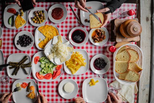 Free Colorful assortment of traditional Turkish breakfast dishes on a red checkered tablecloth. Stock Photo