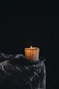 Moody Candlelit Ambiance in Dark Setting