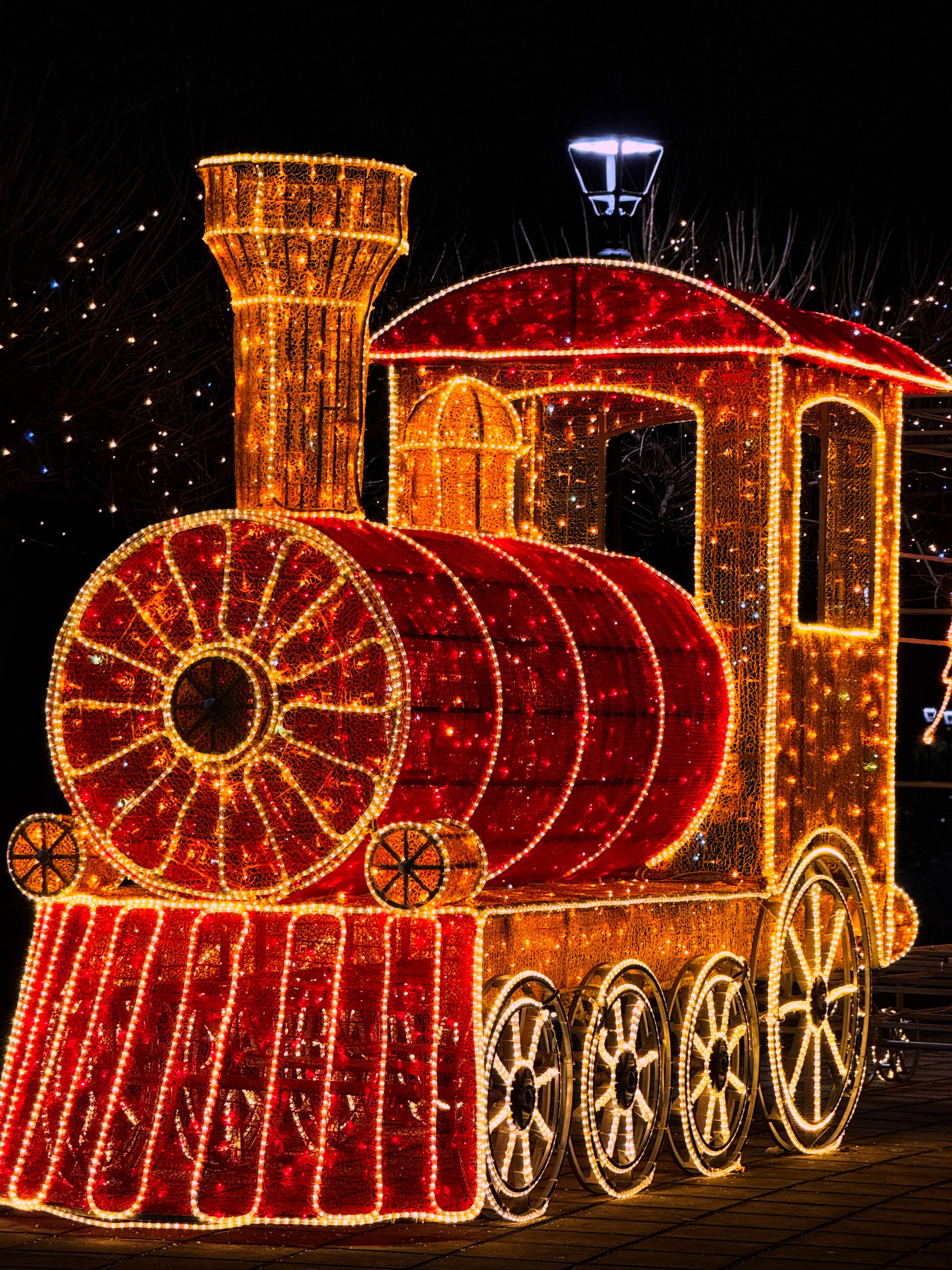 Festive Illuminated Train Display at Night · Free Stock Photo