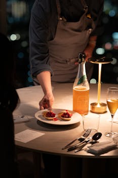 Refined dining setting in a Tokyo restaurant, featuring a gourmet dish at night.