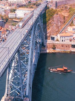 Aerial view of the iconic Dom Luís I Bridge and Douro River in Porto, Portugal.